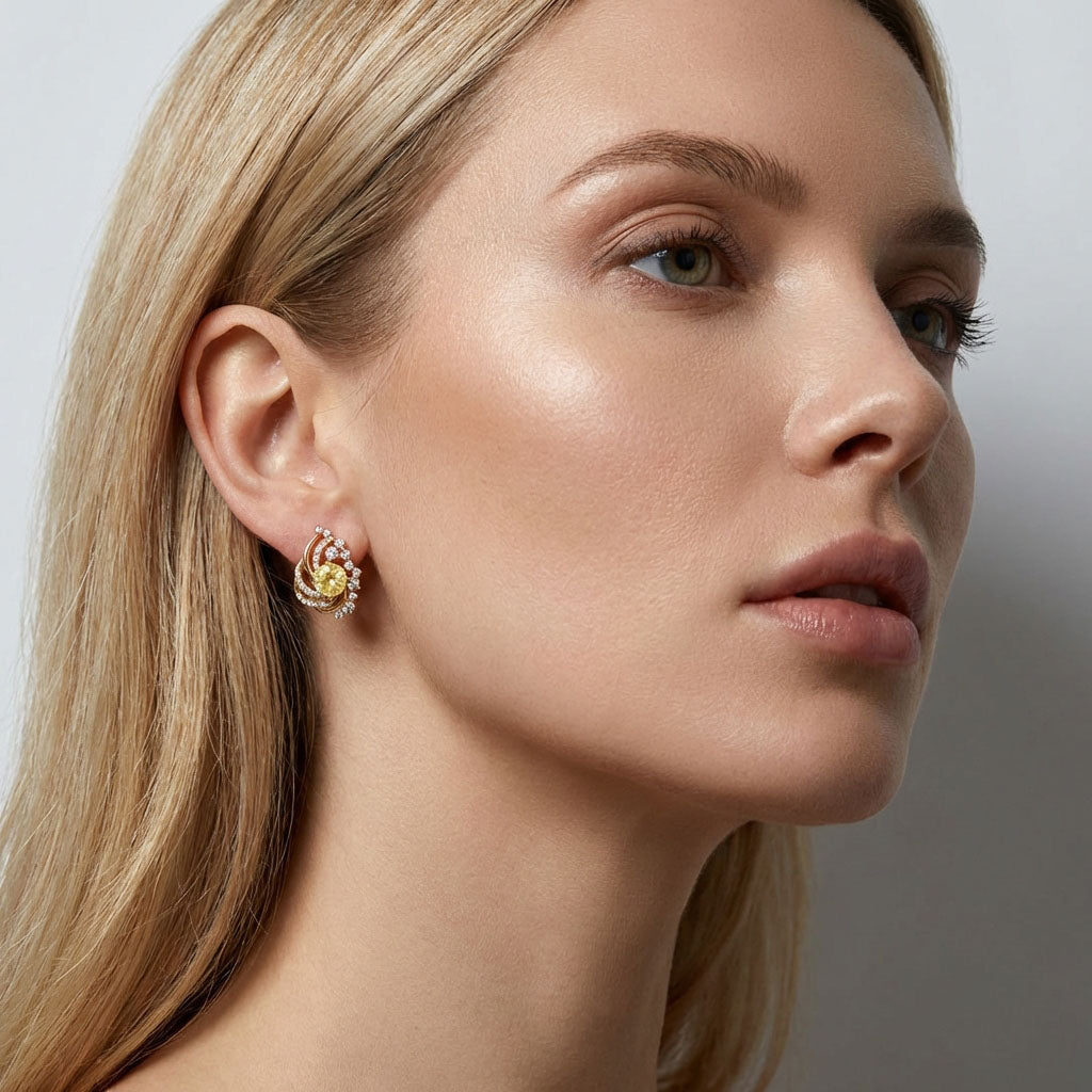 Valdzinoši auskari ar dzeltenu cirkonu