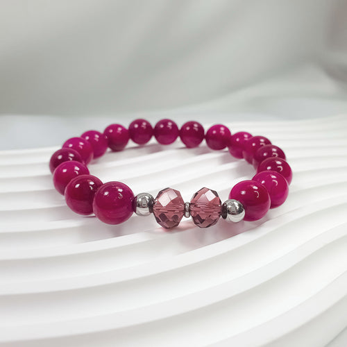 Rozā dolomīta marmora pērļu aproce ar slīpētiem stikla elementiem centrā