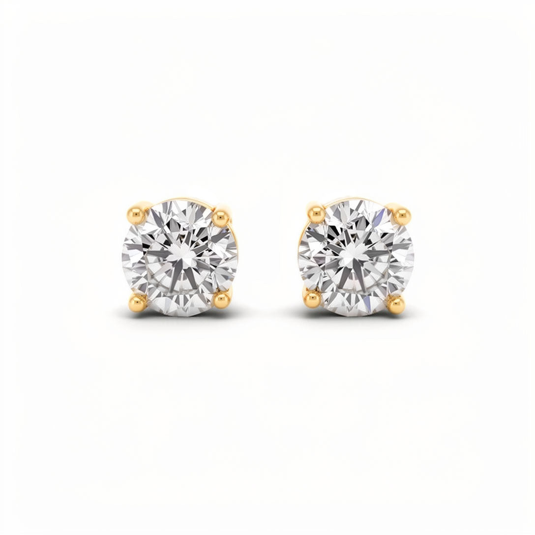 Zelta krāsas nagliņauskari ar lielu, dzidru un mirdzošu cirkonu