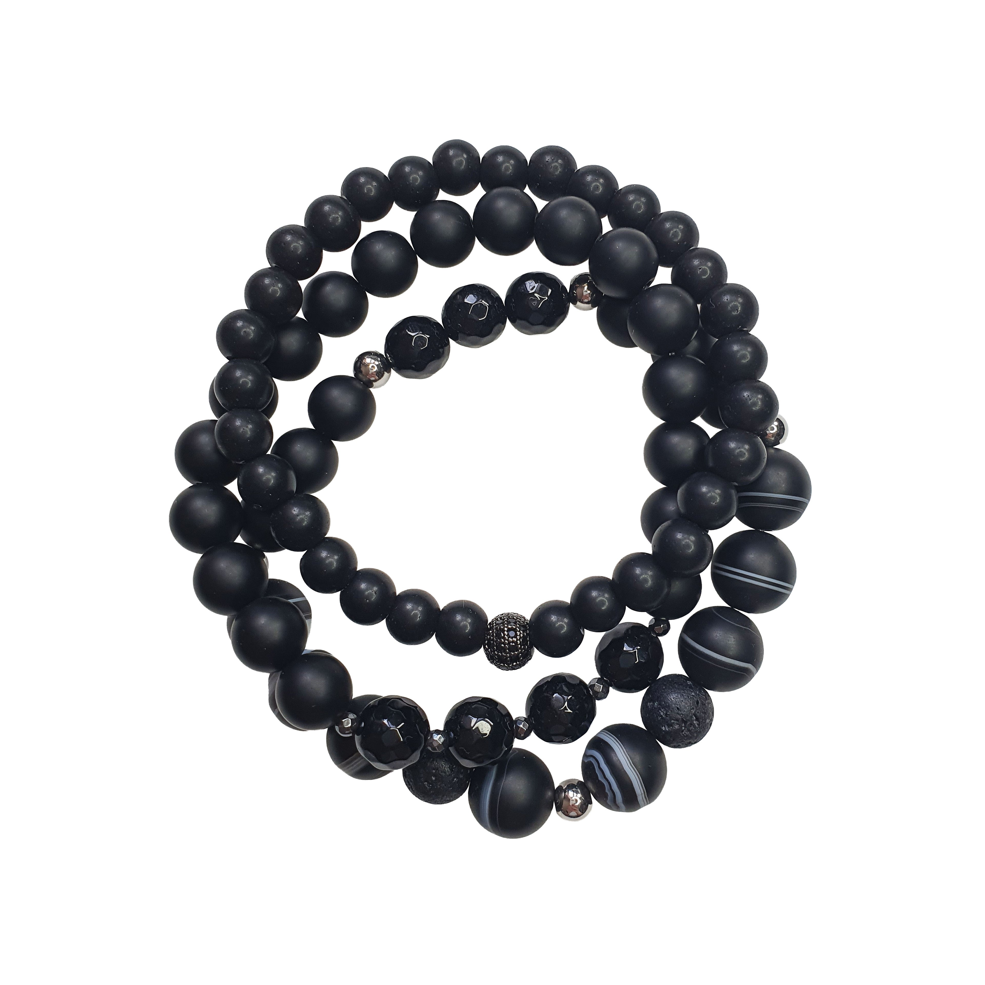 Trīs melnas unisex rokassprādzes no dažādu faktūru akmeņiem